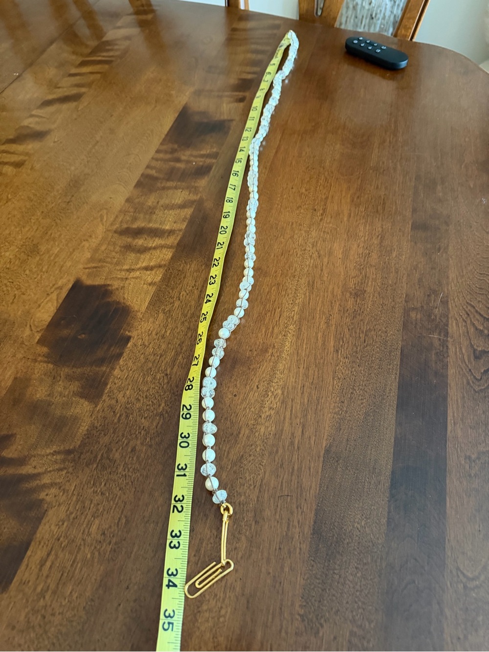 Pearl and moonstone hand roped gold clip and safety pin clasp.